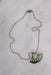 top view of necklace laid flat showcasing miniature ball chain band