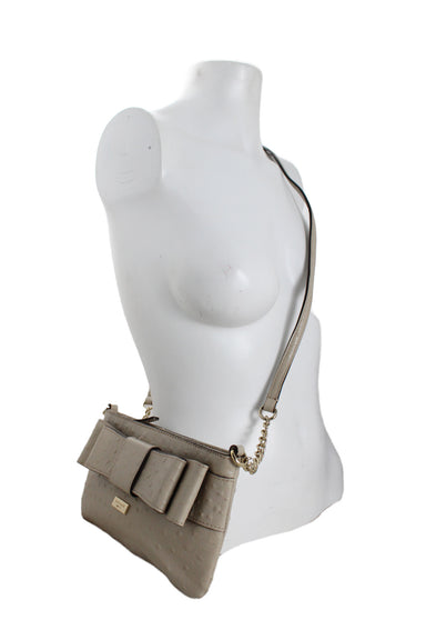 front ¾ view of leather purse styled against feminine bust form