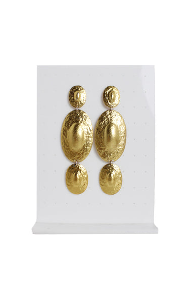 front of vintage gold toned rounded drop earrings. features oval shape. 