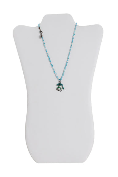 front of claire's blue bead necklace. features beaded design, dolphin pendant with 'best' text, branded charm at neck, and spring ring closure. 