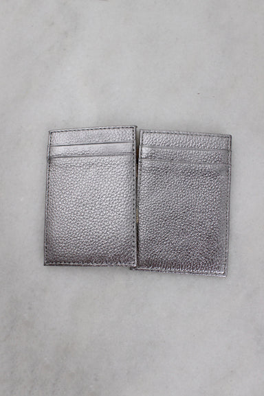 opened exterior angle j.crew faux leather dual card holder featuring pebbled texture and 3-card slots.