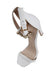 top ¾ view of heels highlighting gold toned metallic buckle closure