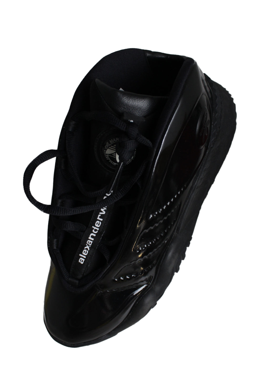 top side view with 'adidas' logo tag at tongue, 'alexander wang' lace tag at tongue of shoes.