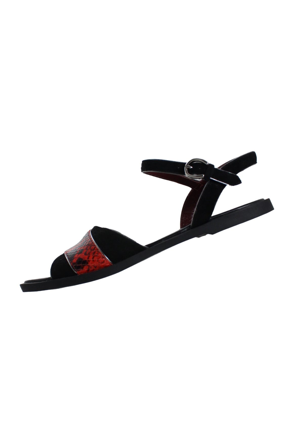 side angle of marc by marc jacobs strappy sandal. snake embossed leather strap across front, open square toe, flat rubber sole, and adjustable buckle suede ankle strap. 