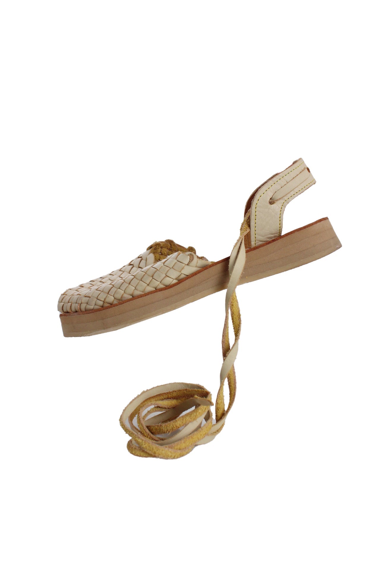 tilted side angle las tres marias beige woven leather sandals featuring woven leather front, back sling strap with lace-up ties, and stacked foam sole 1" sole. 
