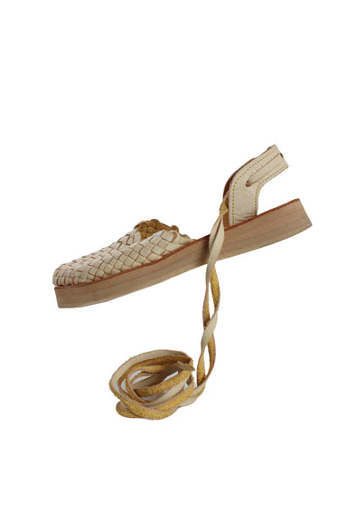 tilted side angle las tres marias beige woven leather sandals featuring woven leather front, back sling strap with lace-up ties, and stacked foam sole 1" sole. 