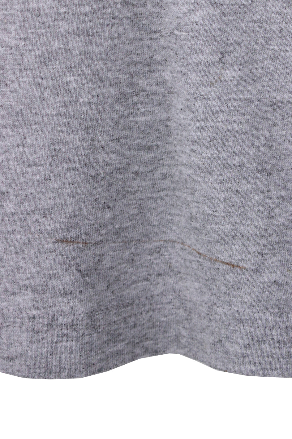 detail of thin line stain near hem. 