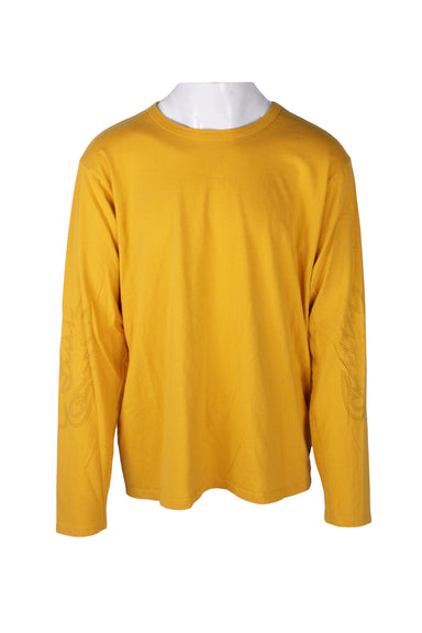 front angle of  bianca chandon yellow long sleeve shirt on masc mannequin torso. features round ribbed collar, straight hem, and dash line faux flame print on both forearms. 