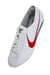 upper angle of nike sneakers. features text 'nike' with swoosh on tongue. 