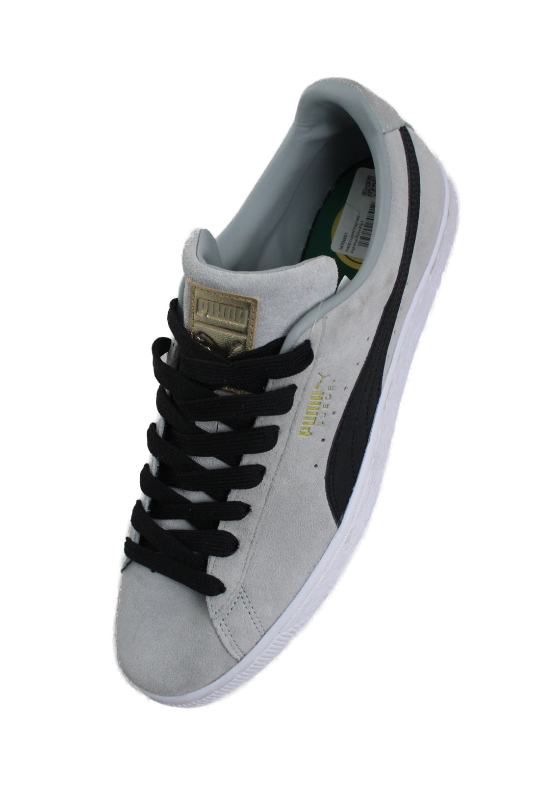 upper angle of puma shoes. features gold text 'puma suede' on side wall and tongue. 
