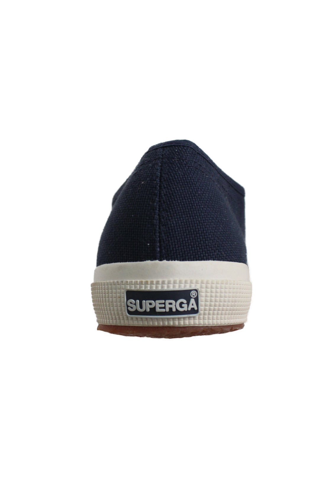 rear of navy sneakers with a contrasting white rubber sole with logo tag on the heel. 