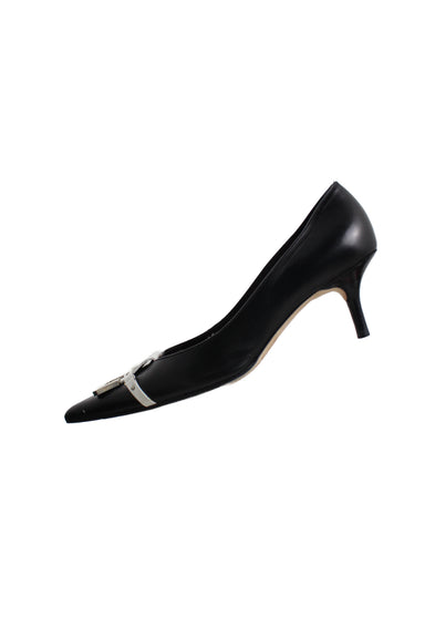 side angle of christian lacroix black kitten heels. features pointed toe with white strap across front, silver grommets, and slip on fit. 