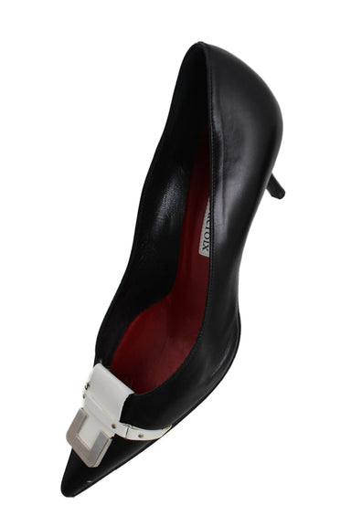 upper angle of christian lacroix kitten heels. features buckle on toe with silver detail and text 'christian lacroix' with red leather insole with text 'christian lacroix'. 