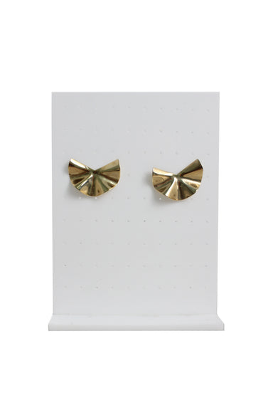 front of unlabeled gold tone abstract earrings. features wavy design, and push back closure. 