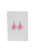 earrings with a rhinestone adorned moon shaped stud and a contrasting pink charm drop of the character hello kitty riding a unicorn staged on an earrings stand. 