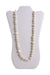 front of vintage money faux pearl necklace. features abstract pearls, gold toned beads link, and lock closure. 