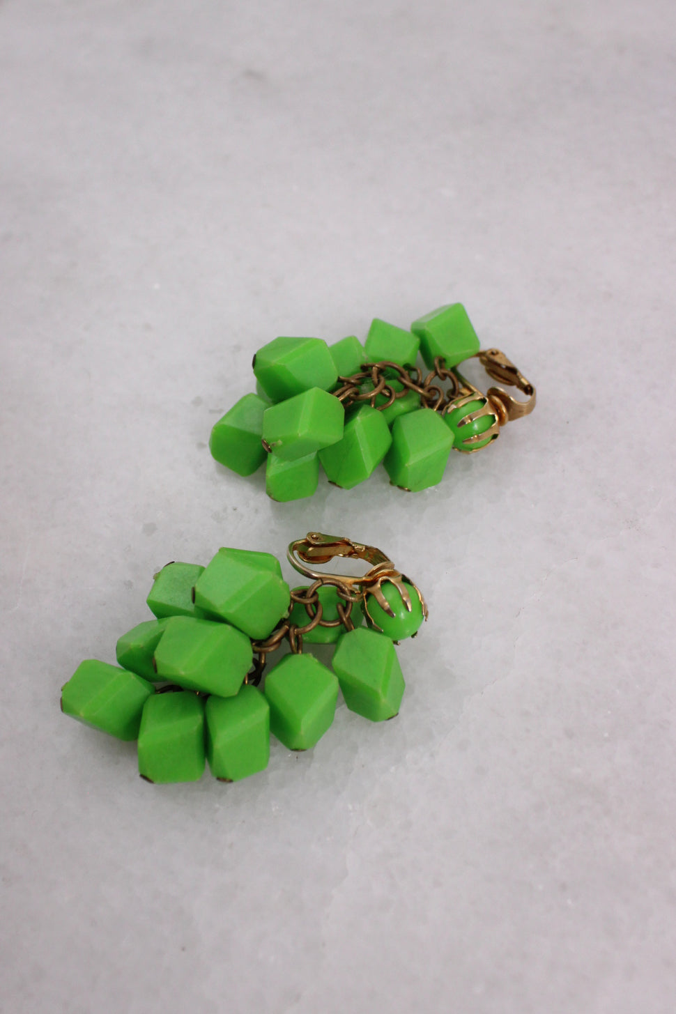 detailed photo of green earrings. 