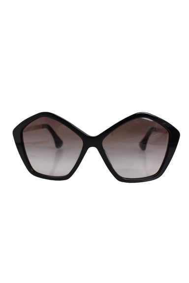 description: miu miu pentagon black sunglasses. features black acetate frame, gradient brown lenses, and branded gold-tone metal hardware temples. 