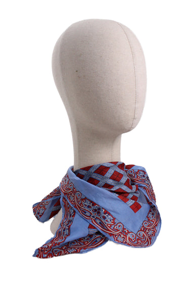 profile of mannequin with vintage hentex blue print scarf. features blue and red paisley/square print throughout, square shape, and finished edges. 