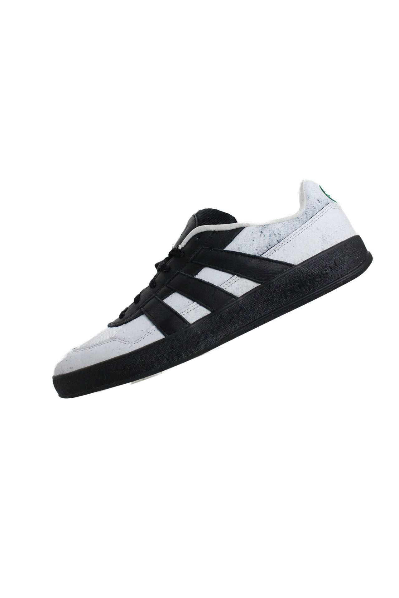 side view of adidas white/black ‘mark gonzales aloha super’ leather shoes. features adidas shmoo logo tag at tongue, ‘mg’ gonz art embroidered at heel, signature stripes at uppers sides, and ‘adidas’ logo embossed at rubber sole.