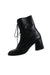 profile of vagabond black ankle boots. features square toe, block heels, lace up closure at front, and zip closure at interior side.