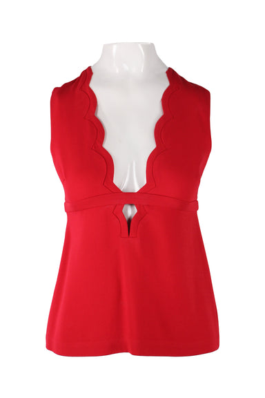 front of a.l.c. red sleeveless top. features plunging v neckline, rounded cut details at neck, strap detail at waist, hook and zip closure at back. 