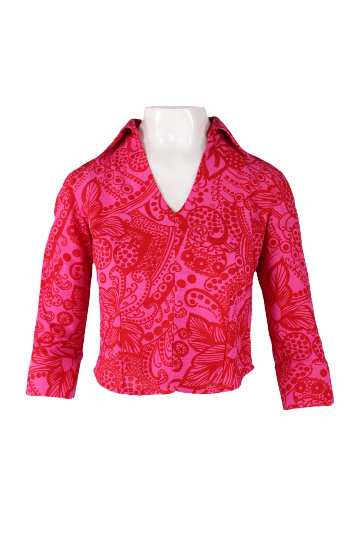 front of  fiorucci pink and red print top. features abstract print throughout, pointed collar, v neckline, 3/4 sleeves, slit at cuffs, and pull on style. 