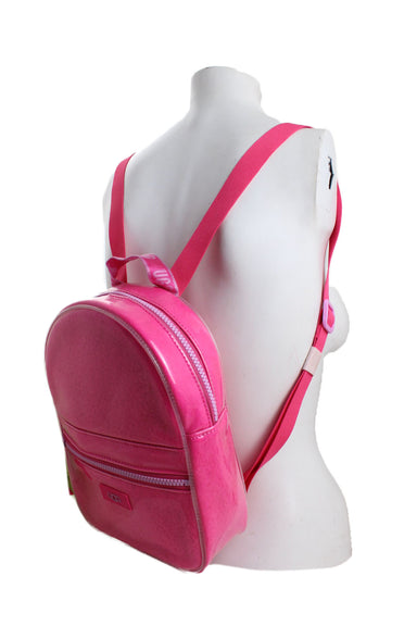 ¾ back profile of hot pink backpack staged on a female bust form