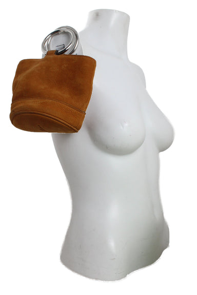 hand bag positioned at mannequin torso. 