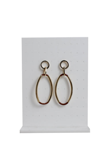 gold toned metallic hoop earrings with a golden tube framed leather loop drop staged on an earring stand