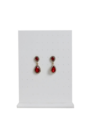 monet red double tear drop shaped earrings staged on an earring stand.