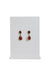 monet red double tear drop shaped earrings staged on an earring stand.