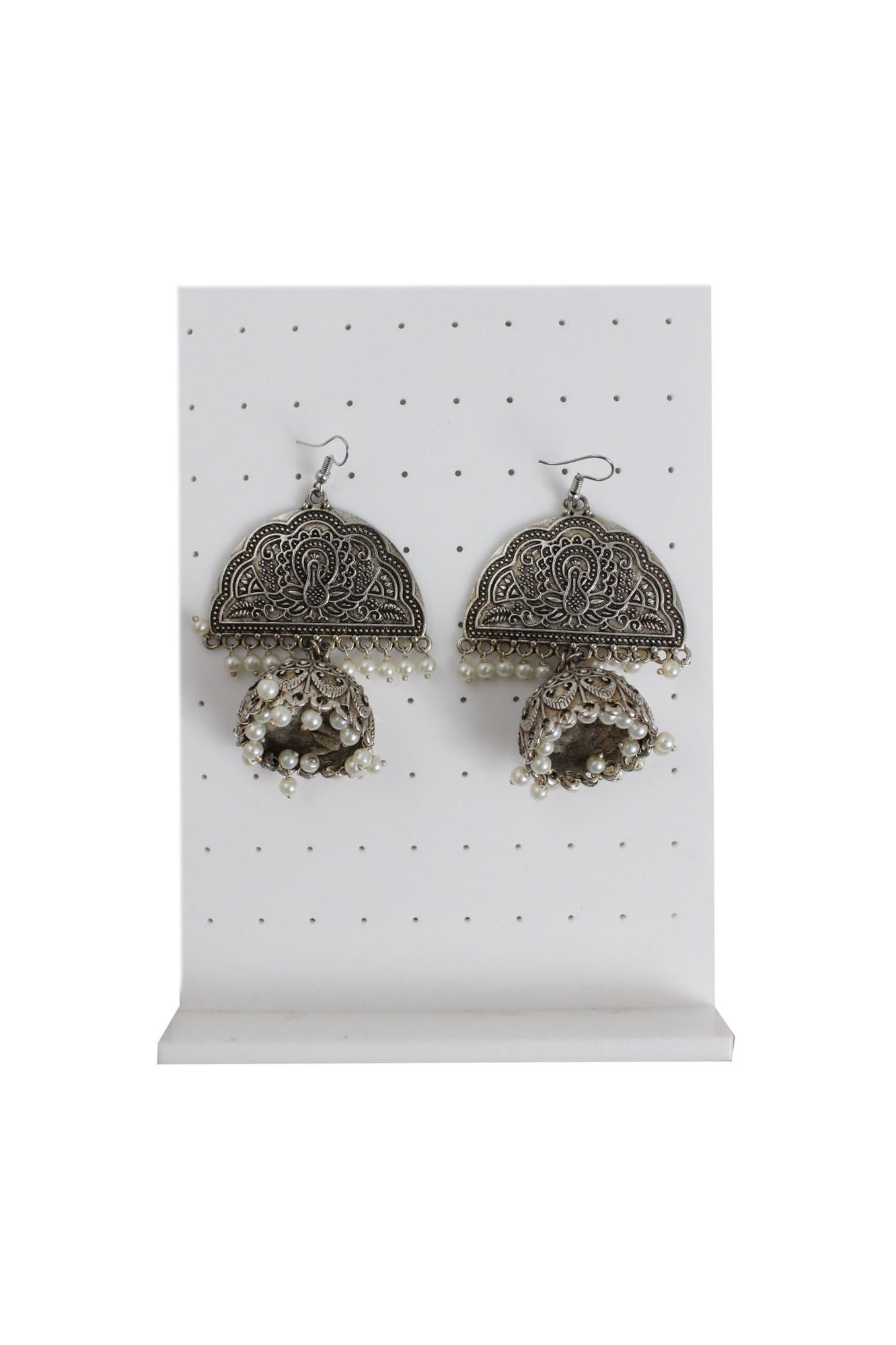 description: unlabeled dark-silver metal peafowl earrings. features embossed detailing, pearl tassel throughout, and hook closure. 