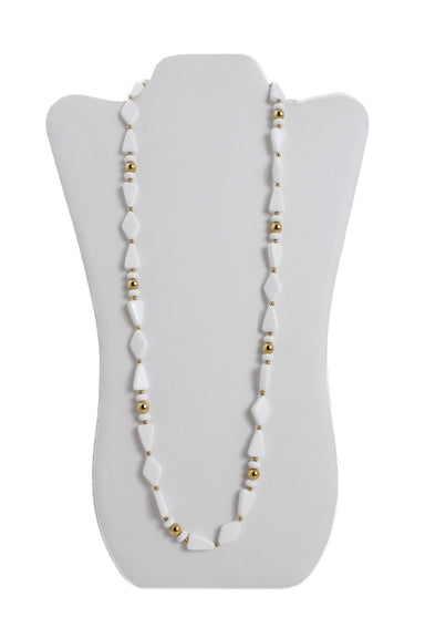 front of trifari white and gold bead necklace. features diamond shapes beads and gold tone beads throughout, embossed brand logo at plate, and spring clasp closure. 