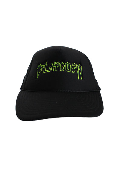 front angle of unlabeled black flatbush trucker hat. features green embroidery across front with text 'flatbush' in bold flame style text. 