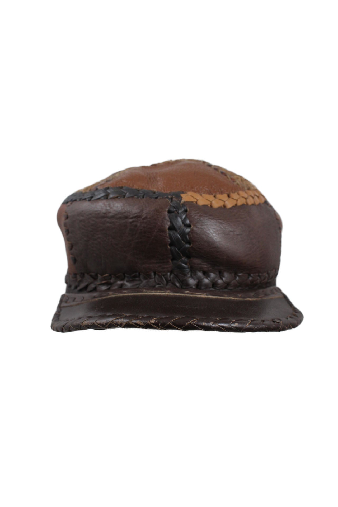 description: vintage brown tones leather patchwork hat. features patchwork design throughout with braided hem. 