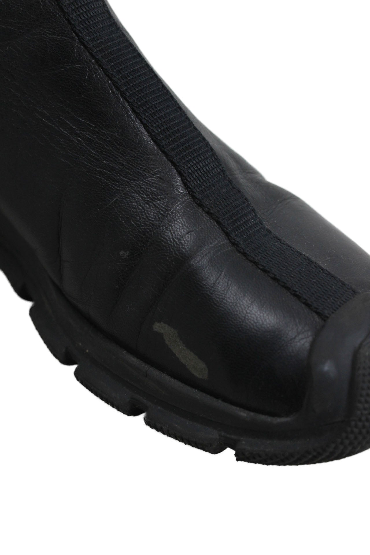 minor scuff at inside of left boot at upper leather