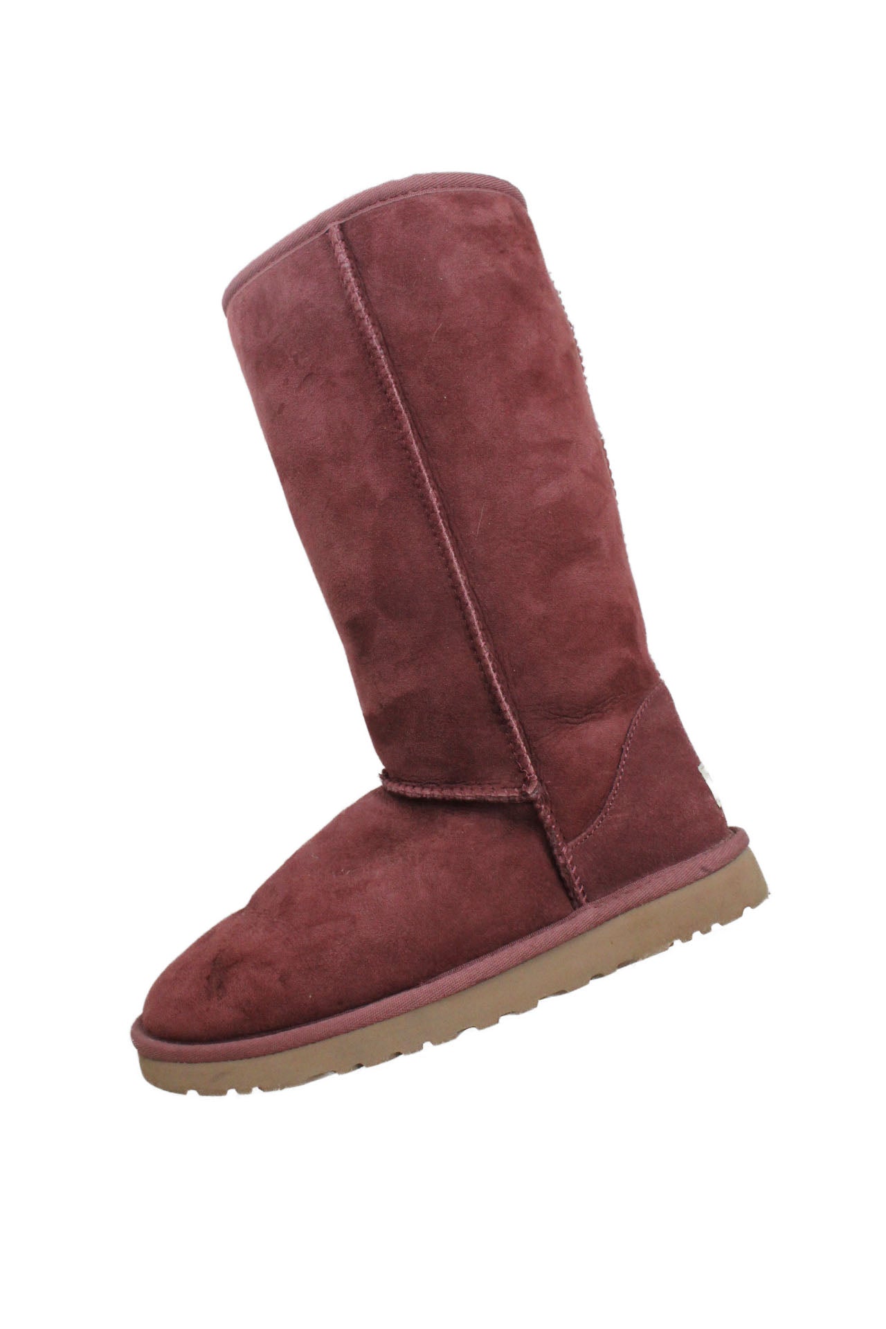side of ugg austrailia raspberry tone high shearling boot. no closure, pull-on style. suede leather outer with shearling fur lining. 