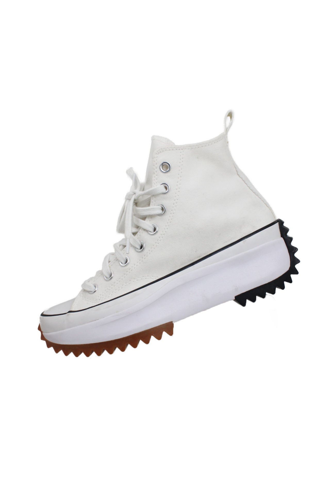 profile of converse white platform high top chuck taylor sneakers. off-white tone canvas upper. lace up closure. chunky 2" platform with toothed tread soles.  