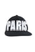 front view of paislee black six panel hat. features plastic bolted down ‘paris’ branding at front, paisley branding printed at back left, and adjustable snapback closure.