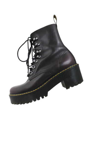 profile of dr. martens burgundy leather platform boots. features rounded toe, contrast stitching in yellow, rubber outsole, and lace up closure at upper. 