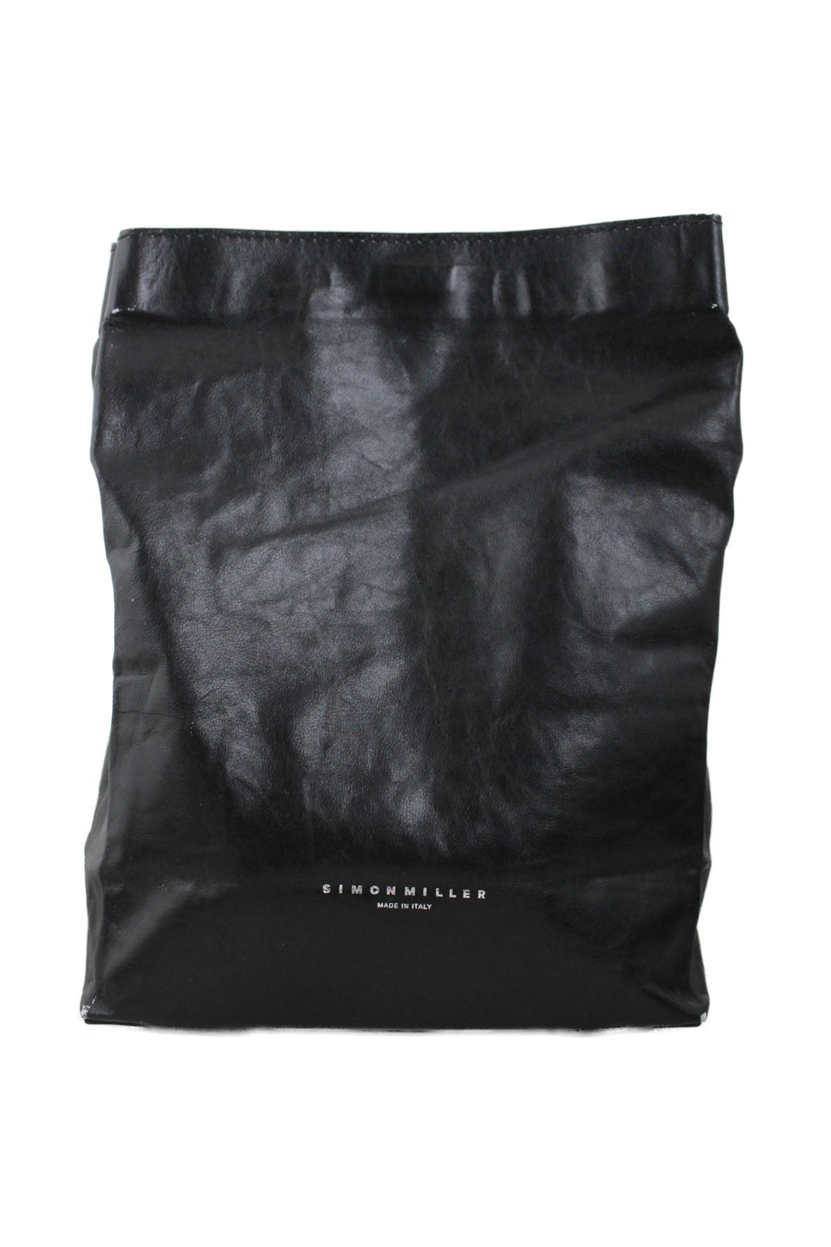 front of simon miller black lunch bag. features embossed silver-toned logo brand, gusseted bottom, and magnetic top closure.