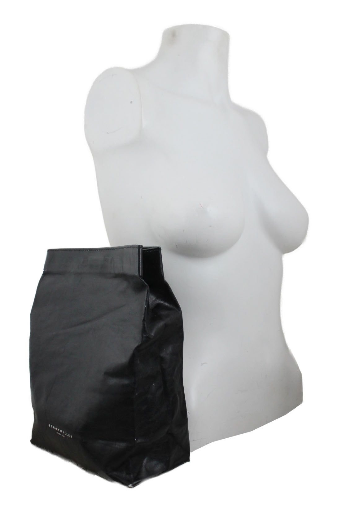 profile of bag positioned at mannequin torso. 