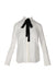 front of dai white silk long sleeve button up. features spread collar, black self tie detail at neck, button at cuffs, and button closure. 