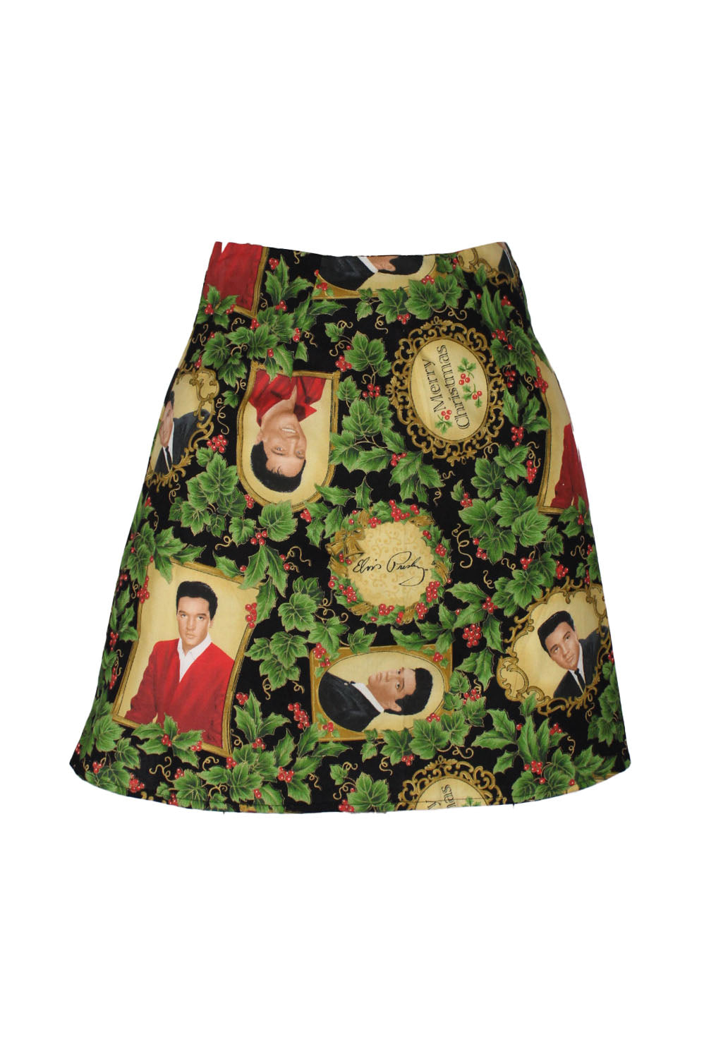 front of girl of the earth black print mini skirt. features elvis presley christmas print throughout, a-line design, and zip closure at back.