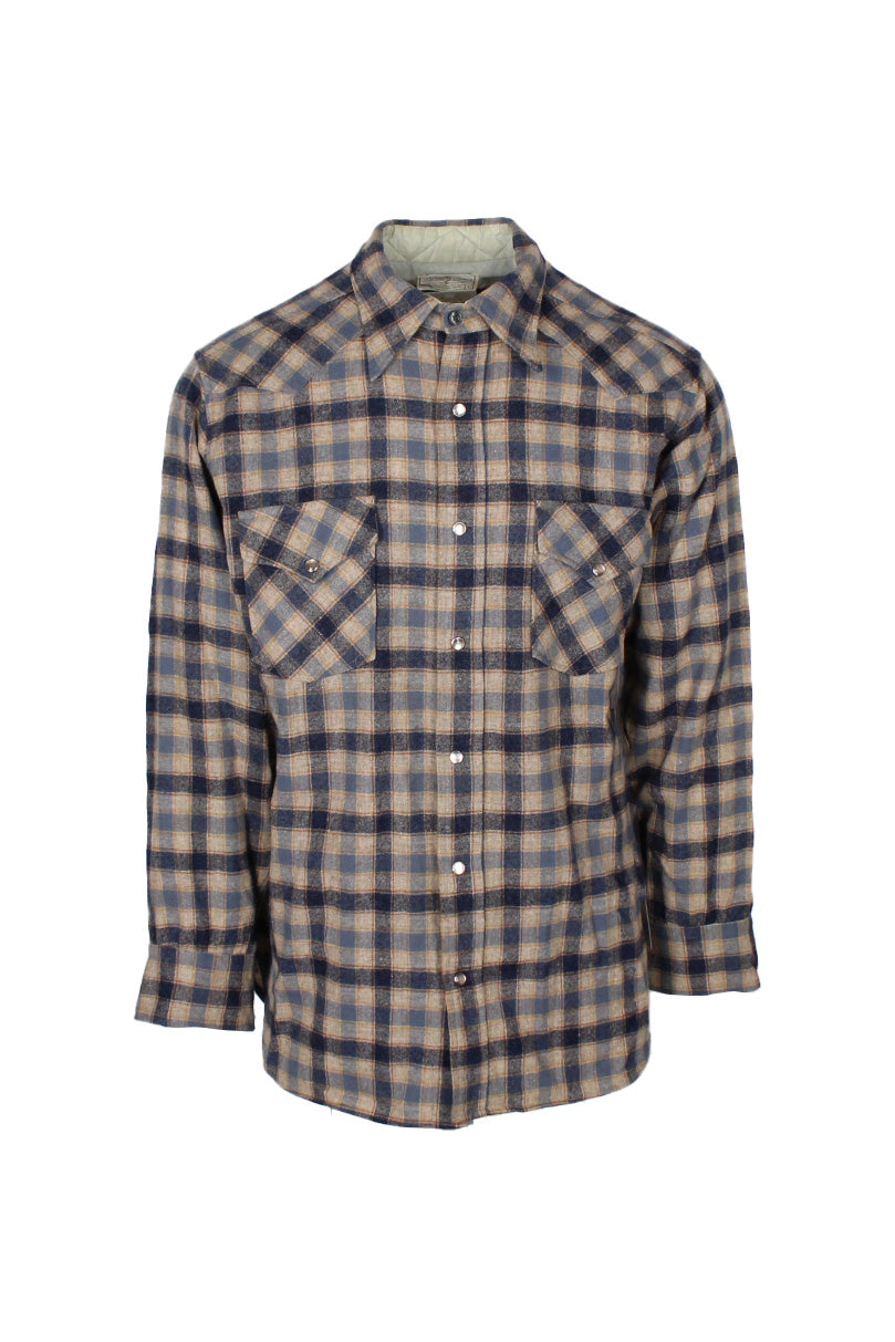 front view of vintage pendleton navy/beige plaid long sleeve button up virgin wool flannel. features double breasted snap flap pockets, snaps at cuffs, and partial lining collar.