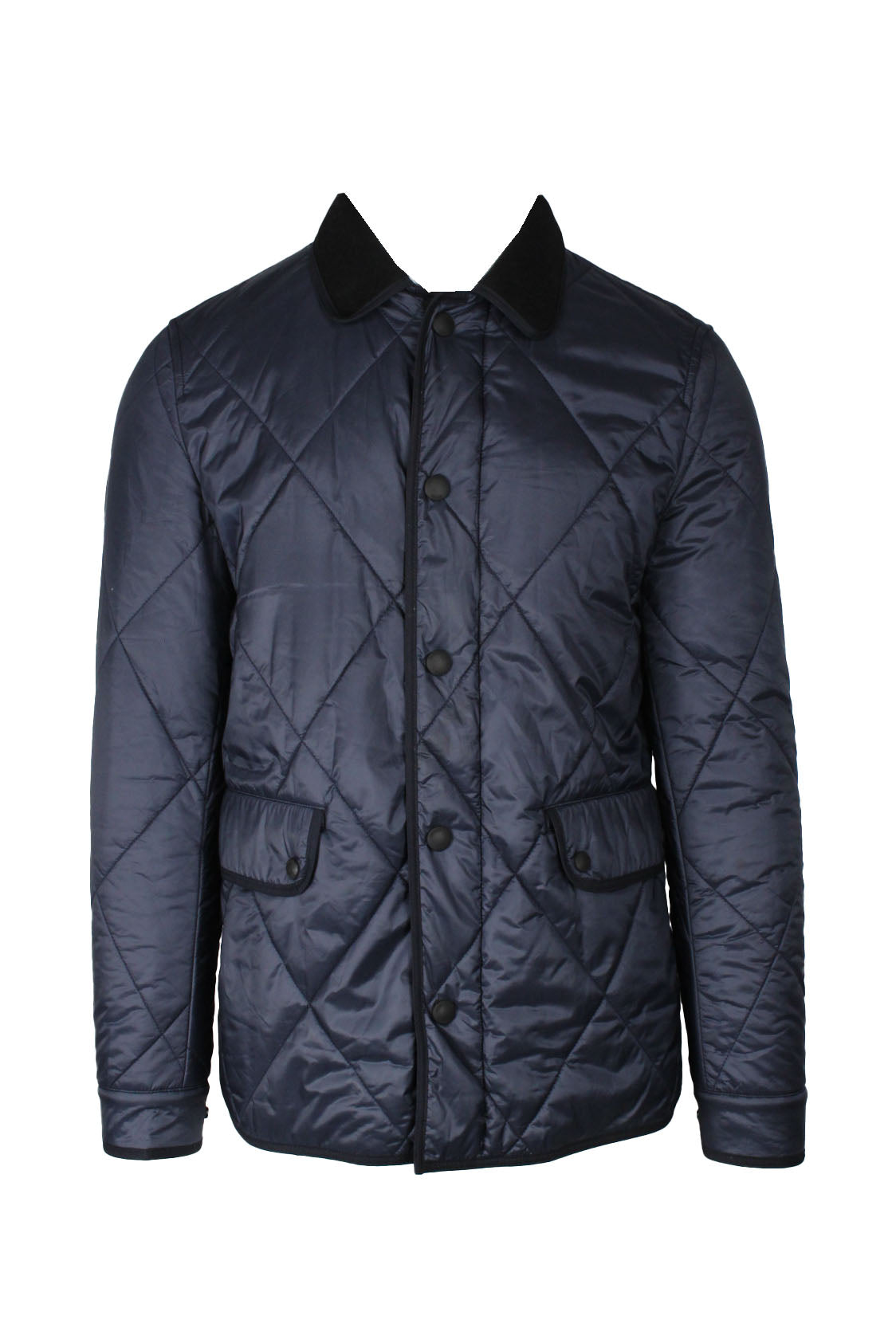 front view of burberry brit navy zip/snap button up quilted jacket. features leather ‘burberry brit’ logo tag at back below fleece collar, front double snap flap pockets, inner snap chest pocket, and snaps at sides of hem/cuffs.