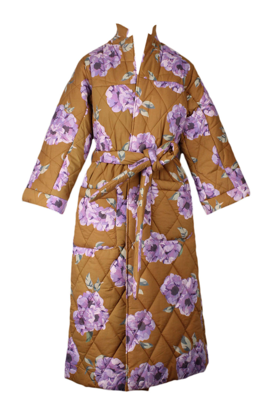 front of rachel antonoff brown cotton maxi puffer coat. features floral print in purple throughout, high neck, tonal stitching, 3/4 sleeves, flap pockets at waist, and self tie belt at waist.  