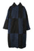 front of stand studio black and blue faux fur coat. features notched lapels, checkered design throughout, slit pockets, and snap button closure; oversized fit. 