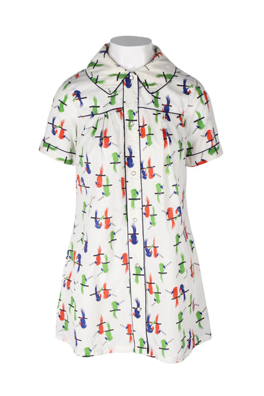 front angle vintage short sleeve mini shirtdress on feminine mannequin featuring wide collar and pearl snap front closure.
